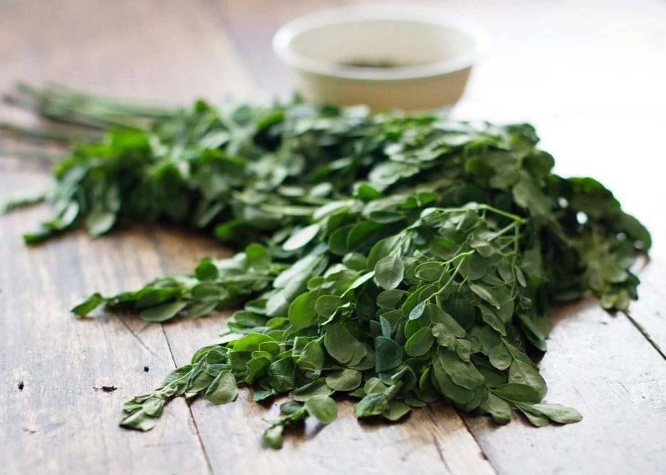 Herbs on a wooden surface.