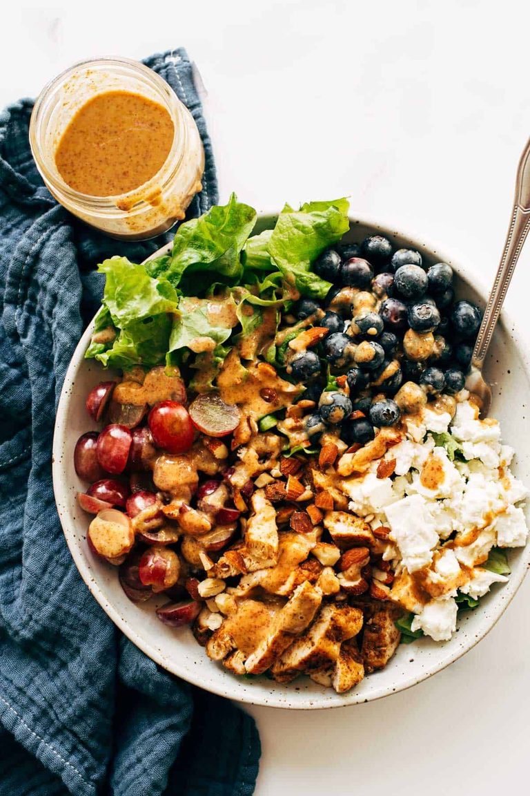 Chicken salad with grapes, blueberries, and cheese.